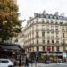 Parisian street corner with a cafe terrace and Haussmann architecture